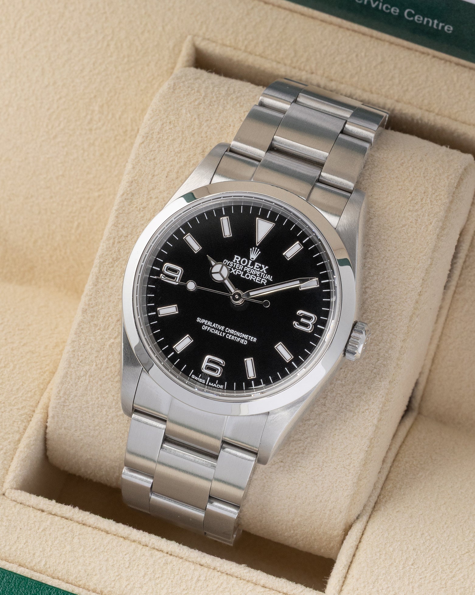 Angled front view of a vintage 2007 Rolex Explorer 114270 featuring a black dial and smooth bezel on an Oyster bracelet