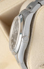 Side profile showing the stainless steel case and signed winding crown of a Rolex Explorer 114270