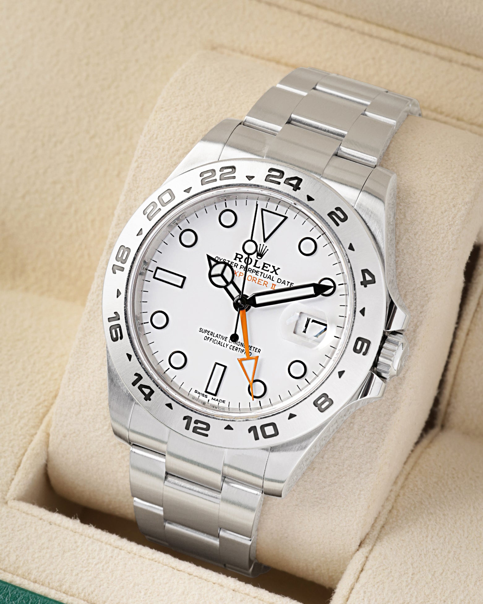 Angled view of Rolex Explorer II 216570 showing the white dial and signature orange GMT 24-hour hand