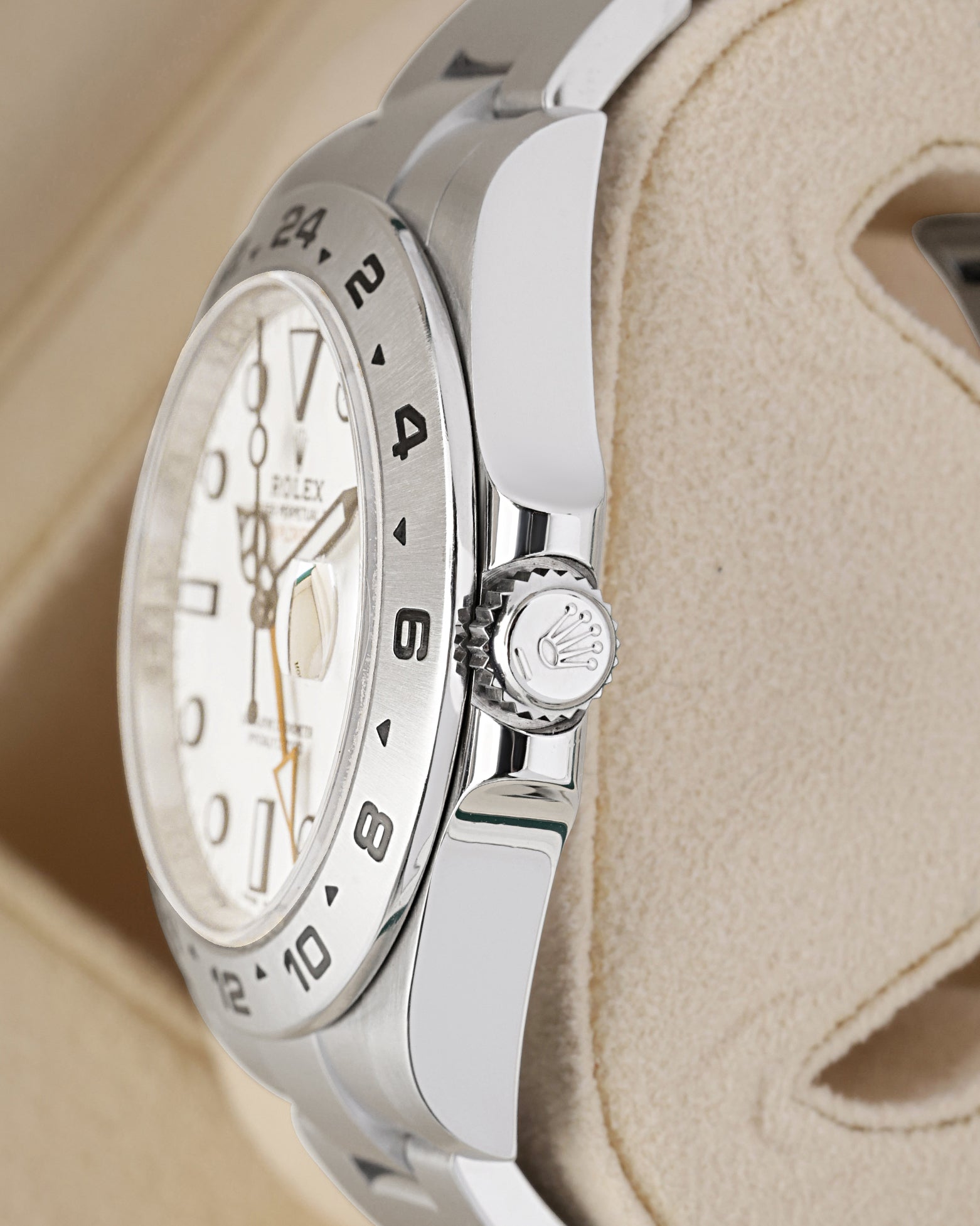Close-up view of the screw-down Twinlock crown and shoulder guards on a Rolex Explorer II 42mm