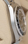 Left side profile view highlighting the slim stainless steel case with visible lug holes on a vintage 1993 Rolex GMT-Master reference 16700