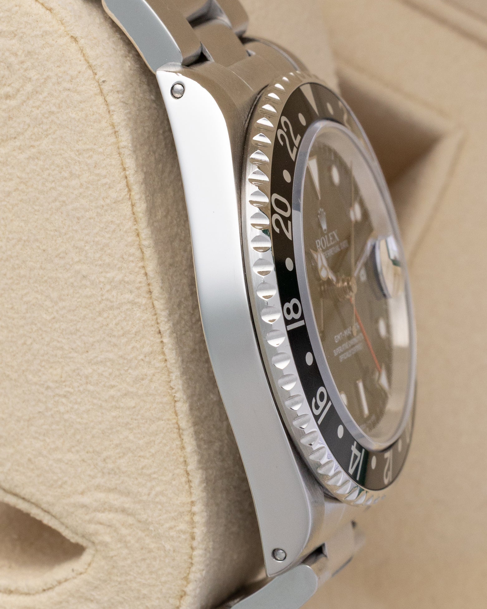 Left side profile view highlighting the slim stainless steel case with visible lug holes on a vintage 1993 Rolex GMT-Master reference 16700