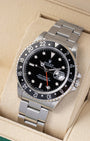 Angled front view of a vintage 1993 Rolex GMT-Master 16700 featuring a black tritium dial, cyclops date display, and bidirectional black 24-hour bezel