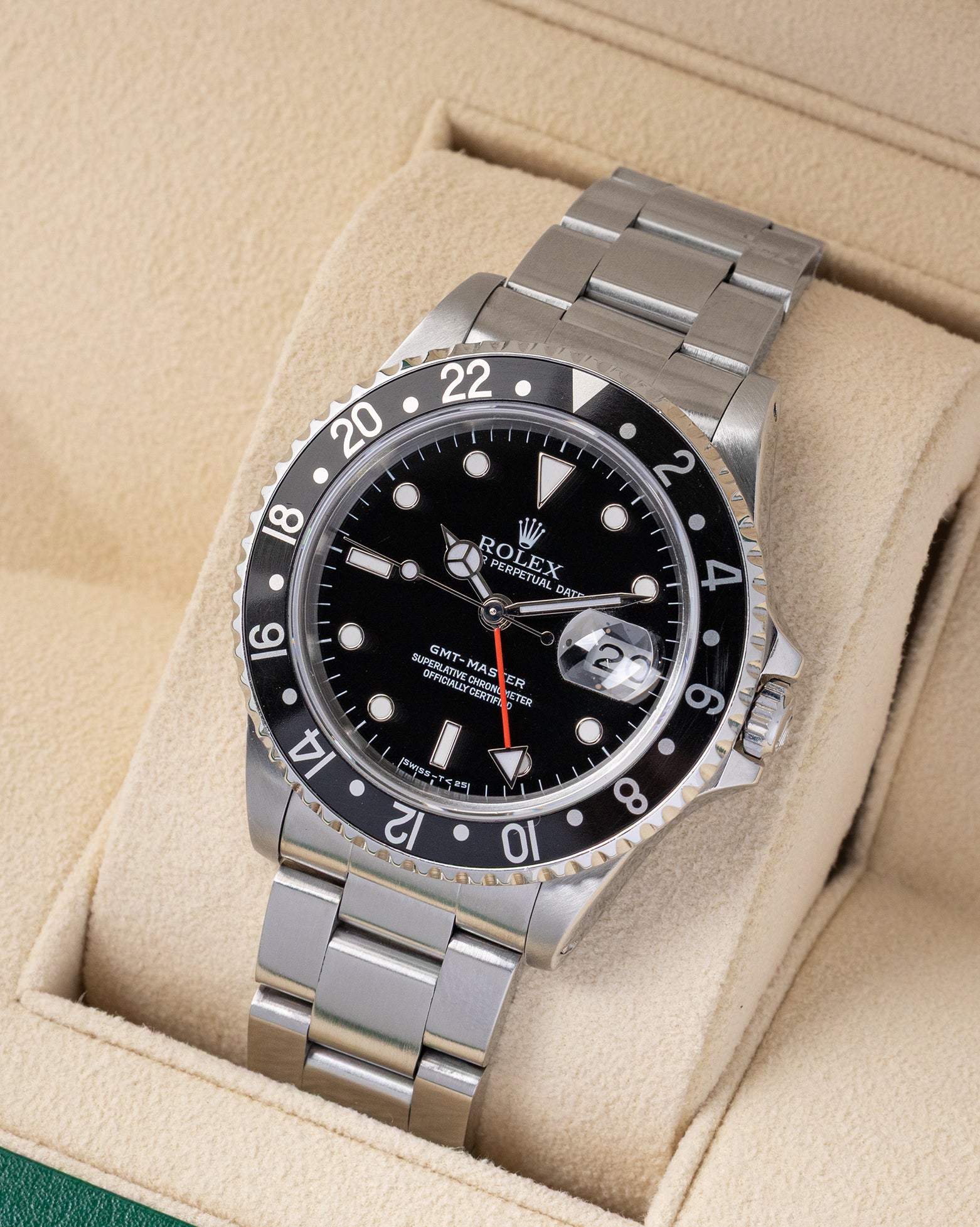 Angled front view of a vintage 1993 Rolex GMT-Master 16700 featuring a black tritium dial, cyclops date display, and bidirectional black 24-hour bezel