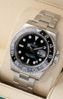 Angled front view of a preowned 2013 Rolex GMT-Master II 116710LN featuring a black dial, green 24-hour hand, and bidirectional black ceramic bezel