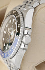 Close-up view of the screw-down Triplock winding crown on a Rolex GMT-Master II Batgirl