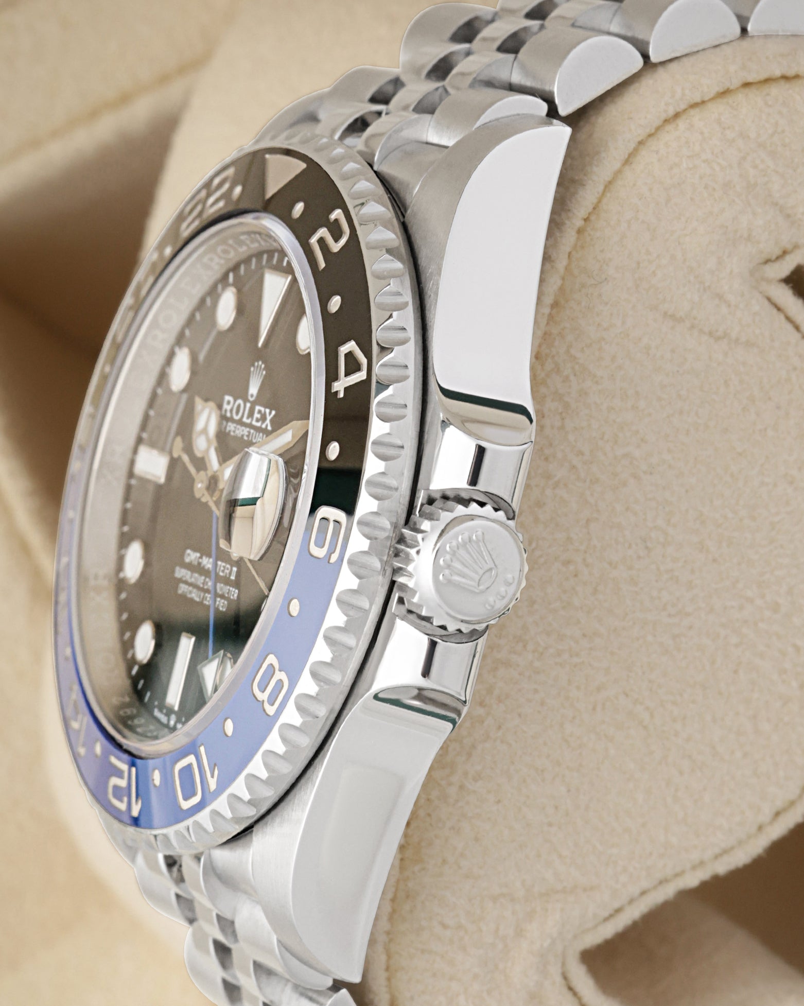 Close-up view of the screw-down Triplock winding crown on a Rolex GMT-Master II Batgirl