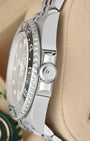 Side view close-up of the Triplock screw-down crown and bi-directional black/grey Cerachrom bezel on Rolex GMT-Master II 126710GRNR