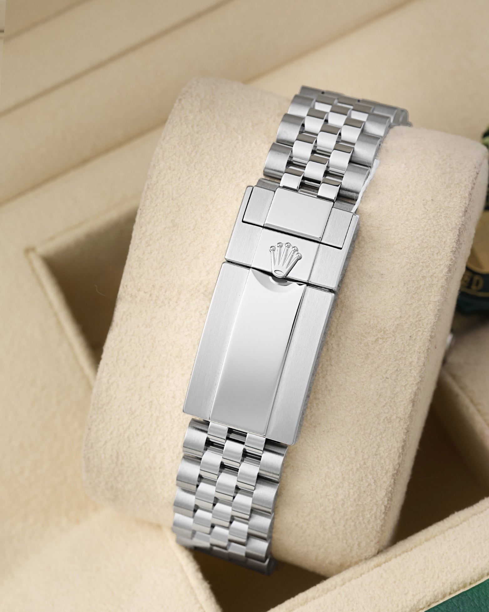 Rear view of the stainless steel Jubilee bracelet showing the folding Oysterlock safety clasp with the embossed Rolex crown coronet logo