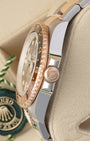Side profile view displaying the 18k Everose gold Triplock winding crown and two-tone case on Rolex GMT-Master II Root Beer 126711CHNR.