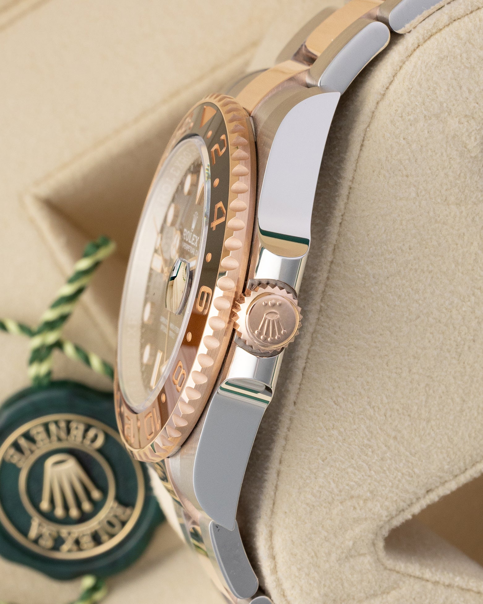 Side profile view displaying the 18k Everose gold Triplock winding crown and two-tone case on Rolex GMT-Master II Root Beer 126711CHNR.