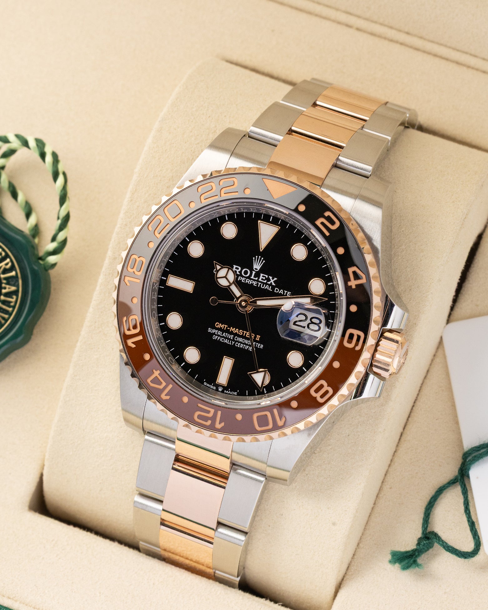 Angled view of pre owned 2026 Rolex GMT-Master II ref 126711CHNR featuring two-color black and brown Cerachrom ceramic bezel and black dial