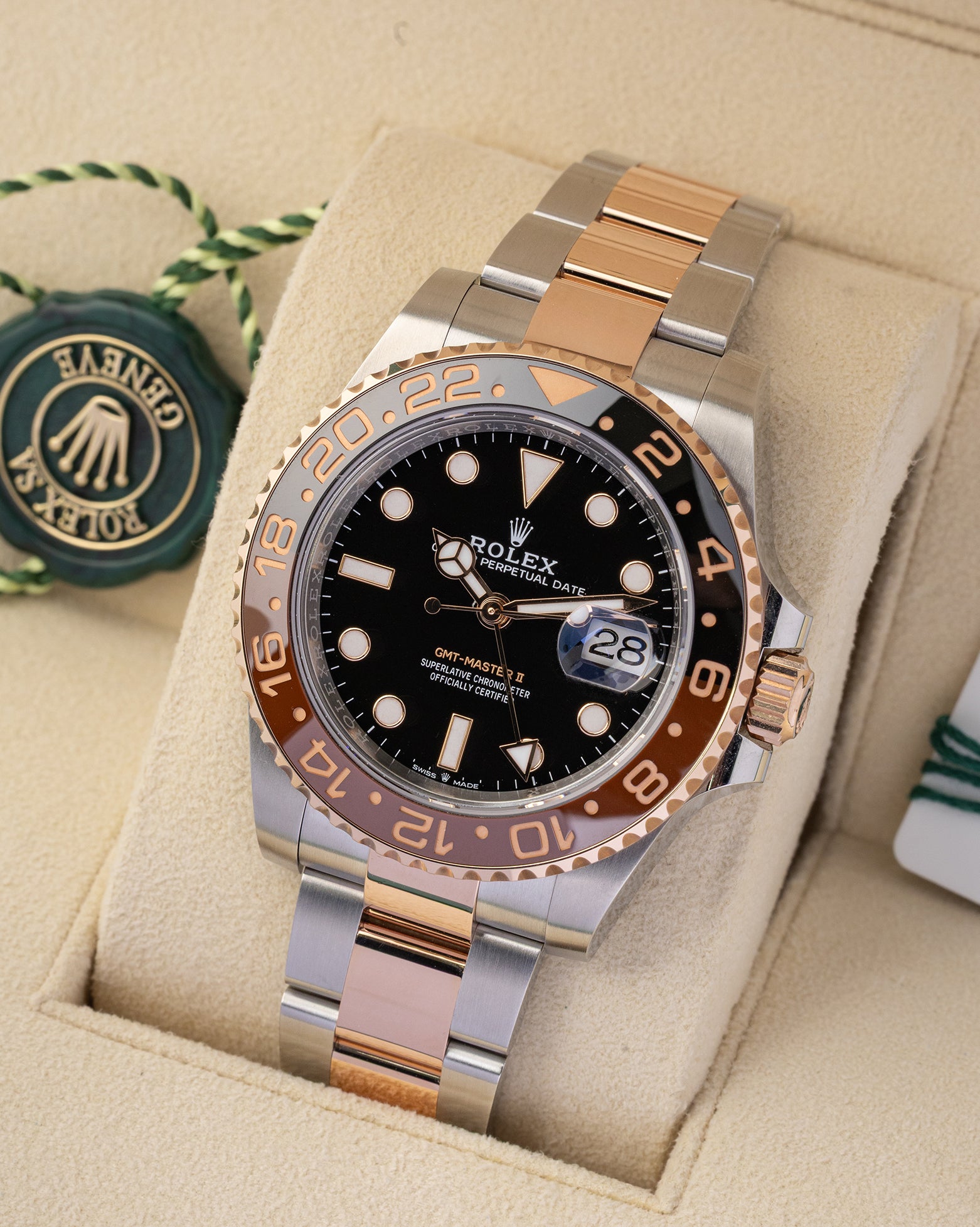 Angled view of preowned 2023 Rolex GMT-Master II ref 126711CHNR featuring two-color black and brown Cerachrom ceramic bezel and black dial