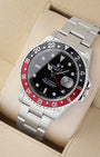 An angled studio profile shot of the stainless steel case and Oyster link bracelet of a Rolex GMT-Master II 16710 Coke