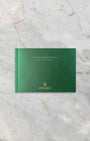 Official green Rolex GMT-Master II instruction manual booklet included with watch set at Noah's Fine Watches & Jewelry
