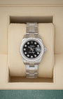 balanced front studio portrait of a 26mm Rolex Lady-Datejust 179384 watch with a black diamond dial and factory diamond bezel inside its presentation box