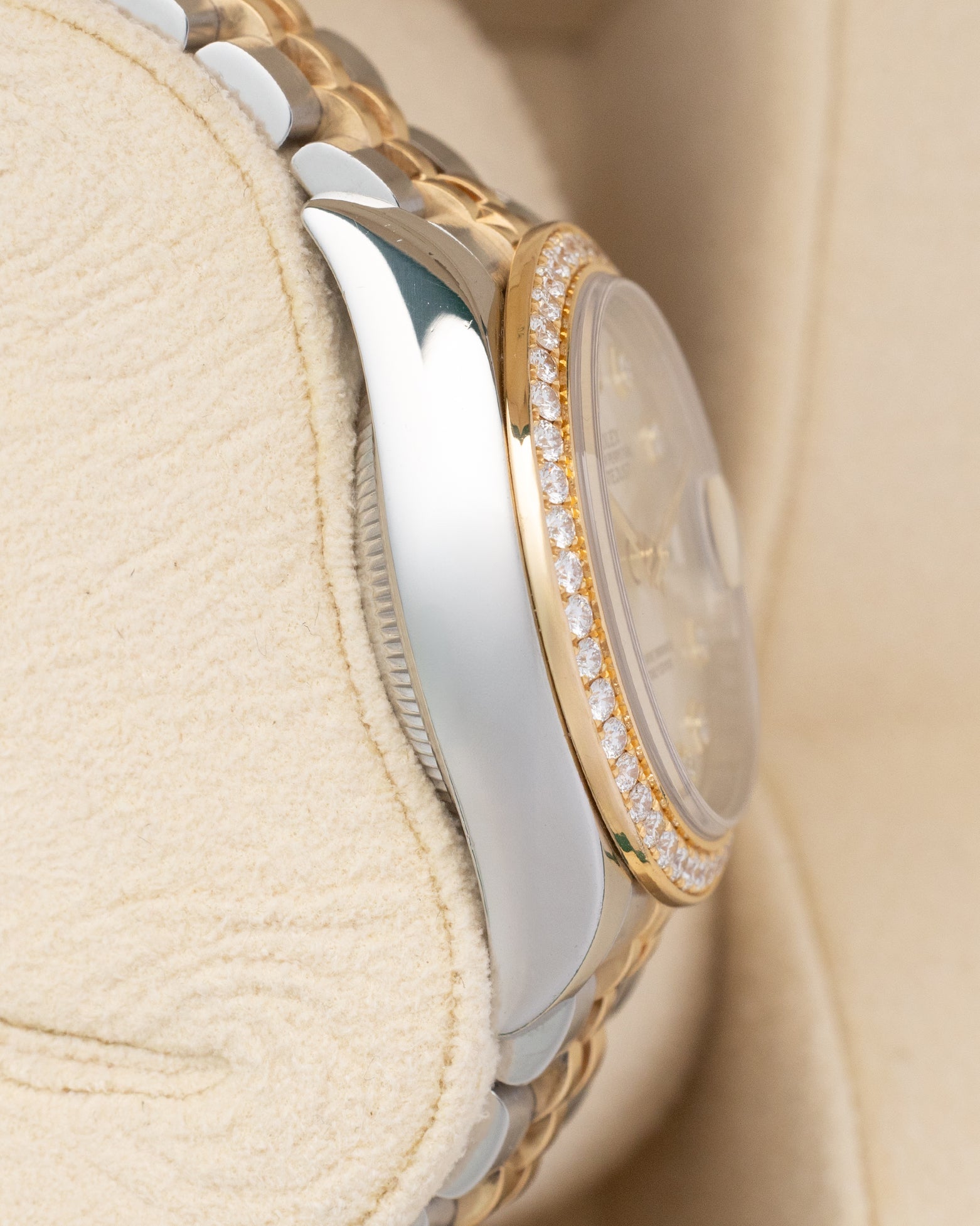 Left side profile view highlighting the polished stainless steel case and 18k yellow gold diamond bezel profile on a 2022 Rolex Lady-Datejust reference 279383RBR