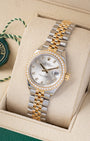 Angled front view of a pre owned 2022 Rolex Lady-Datejust 279383RBR featuring a silver sunray dial with diamond hour markers, diamond bezel, and two-tone Jubilee bracelet