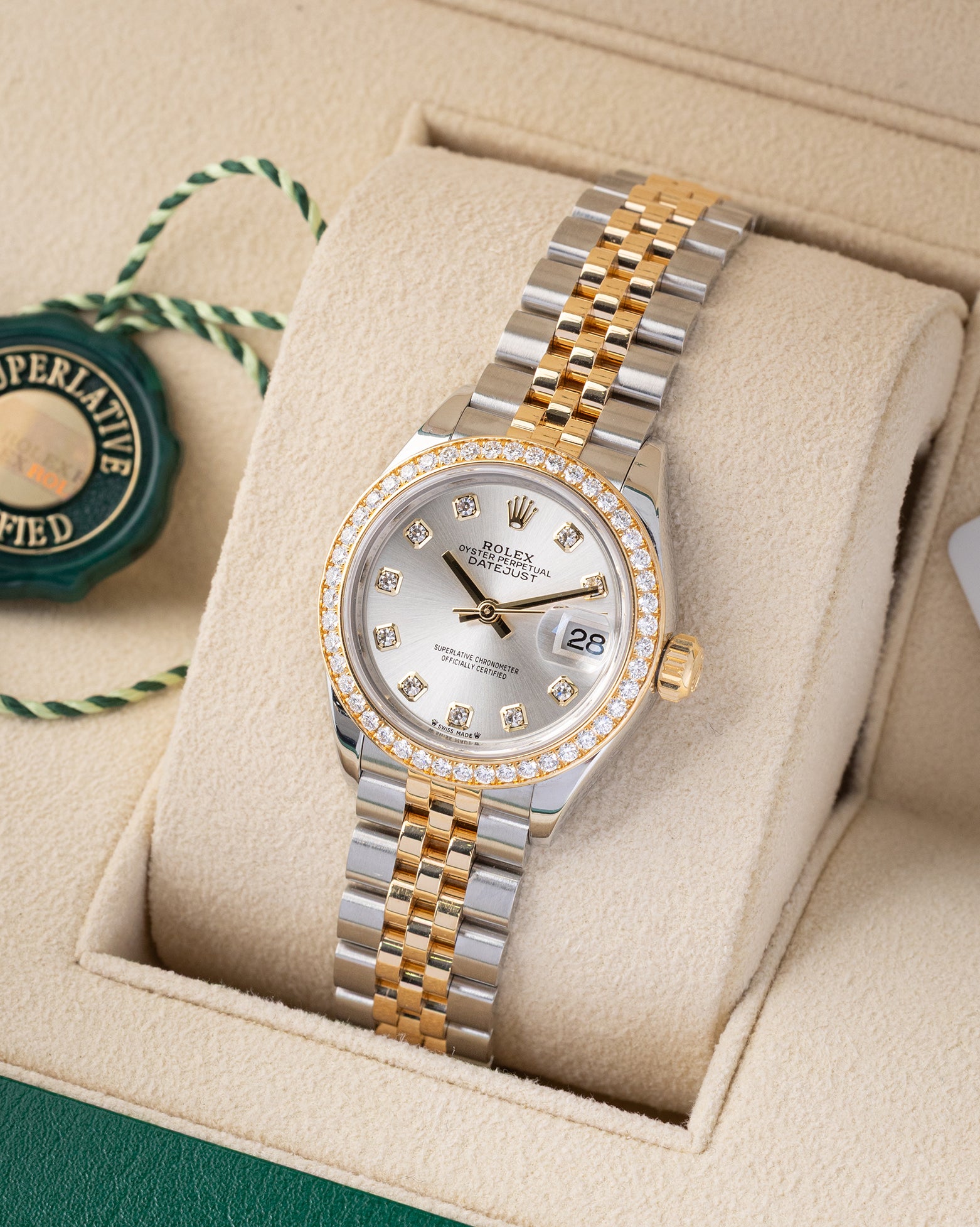 Angled front view of a pre owned 2022 Rolex Lady-Datejust 279383RBR featuring a silver sunray dial with diamond hour markers, diamond bezel, and two-tone Jubilee bracelet