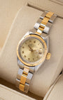 Angled view of a vintage 1981 Rolex Lady-Datejust 6916 featuring a champagne champagne dial, fluted bezel, and two-tone Oyster bracelet.