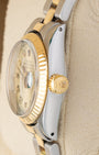 Side profile view showing the 18k yellow gold winding crown and fluted bezel on a vintage Rolex Lady-Datejust 6916.