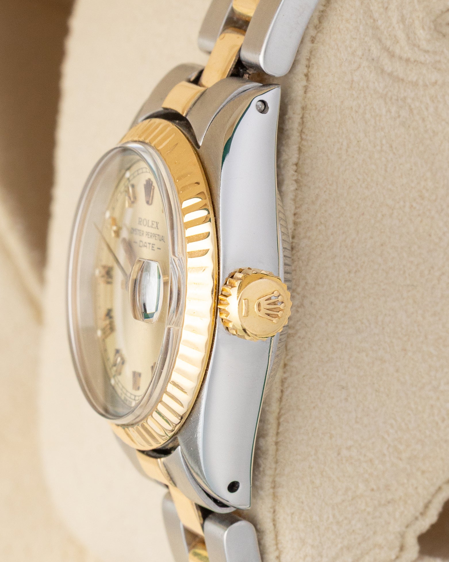 Side profile view showing the 18k yellow gold winding crown and fluted bezel on a vintage Rolex Lady-Datejust 6916.