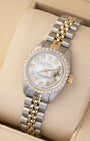 Angled shot of a 1979 Rolex Lady-Datejust 26mm 6917 showing the mother of pearl dial, diamond hour markers, and two-tone Jubilee bracelet.