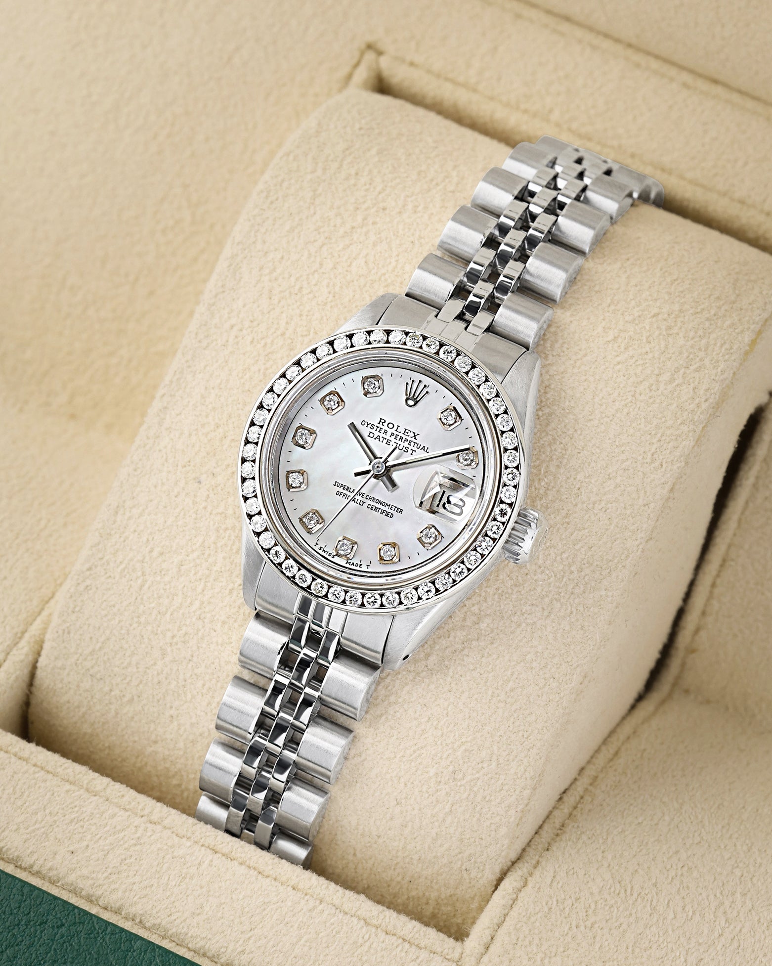 angled profile view of a vintage stainless steel Rolex Lady-Datejust 6917 showcasing custom diamond hour markers and a brilliant cut diamond bezel