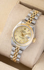 angled profile view of a vintage two-tone Rolex Lady-Datejust 69173 showcasing factory diamond hour markers and a gold fluted bezel