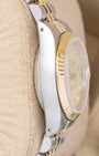 left-side case profile view of a vintage steel and 18k yellow gold 26mm Rolex Oyster case resting on a presentation cushion