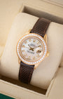 Angled shot of a 1984 Rolex Lady-Datejust 26mm reference 69178 showing white mother of pearl diamond hour markers and factory diamond bezel.