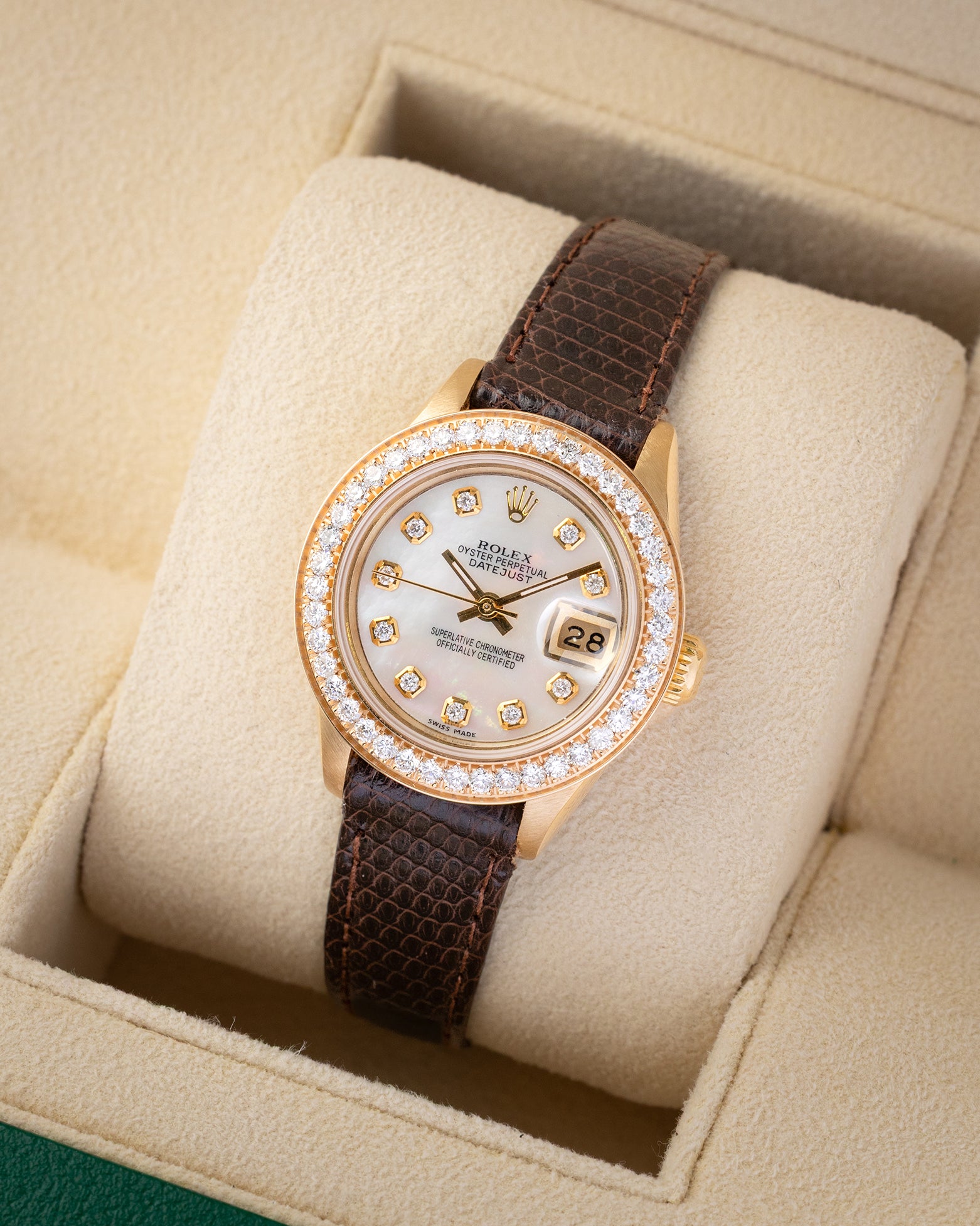 Angled shot of a 1984 Rolex Lady-Datejust 26mm reference 69178 showing white mother of pearl diamond hour markers and factory diamond bezel.