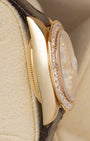 Left side profile view highlighting the polished 18k yellow gold case and thin profile of a 1984 Rolex Lady-Datejust reference 69178.
