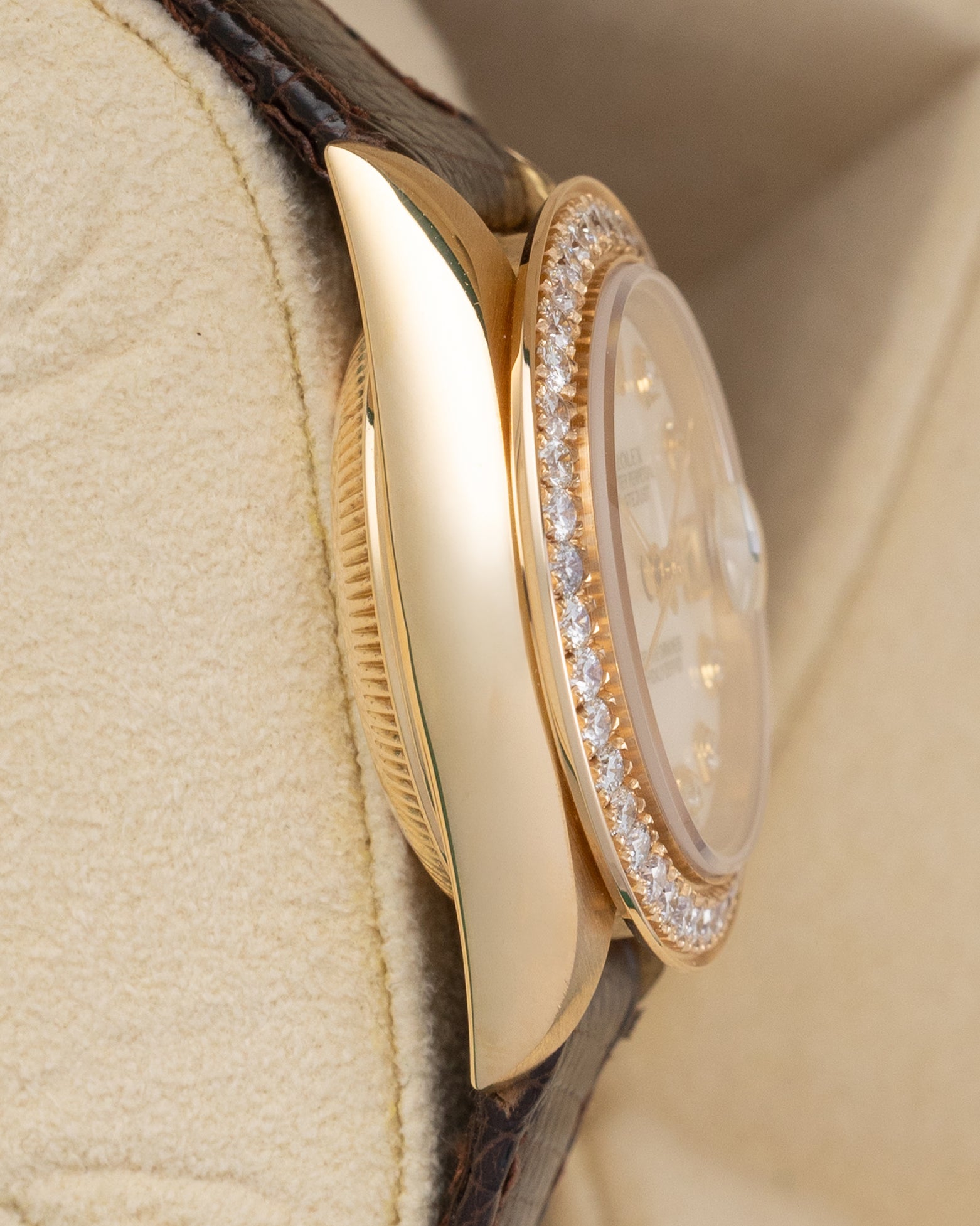 Left side profile view highlighting the polished 18k yellow gold case and thin profile of a 1984 Rolex Lady-Datejust reference 69178.