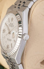 Close-up right profile view of the watch head highlighting the remarkably slim 9.6mm case height profile, the 18k white gold fluted bezel details, and the signed screw-down crown