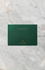The clean front profile view of the dark green official Rolex Land-Dweller user manual booklet detailing the mechanical operation of the sequential distribution Dynapulse escapement