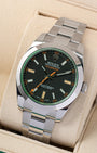 Angled front view of a preowned 2019 Rolex Milgauss 116400GV featuring a black dial, green glace sapphire crystal, and polished smooth bezel