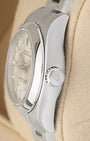 Close-up right profile view of the slim watch head highlighting the smooth domed steel bezel edge, scratch-resistant sapphire crystal, and the fluted Twinlock screw-down winding crown