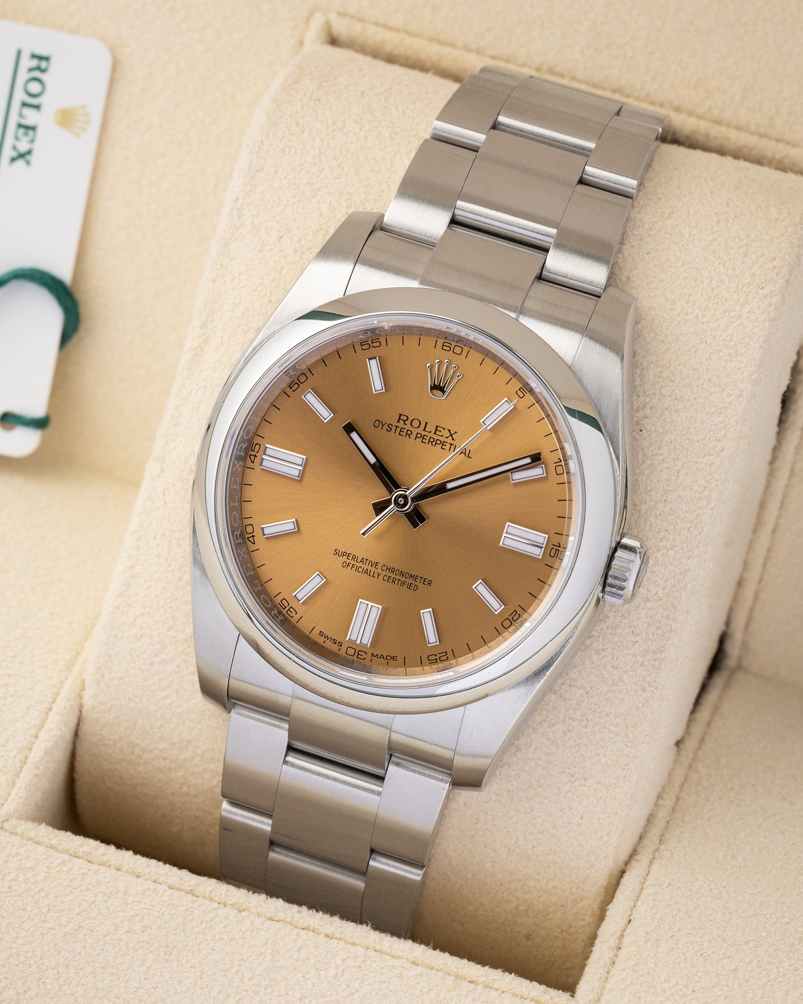 Angled view of pre-owned Rolex Oyster Perpetual 36mm reference 116000 featuring a white grape dial and smooth steel bezel