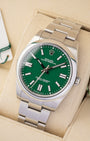 Angled view of pre-owned 2022 Rolex Oyster Perpetual 41mm reference 124300 featuring a green dial and smooth steel bezel