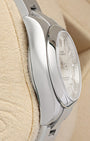 Left-side macro profile view showcasing the high-polished finish across the monobloc steel case band flank and the sweeping curve of the integrated professional sports lugs