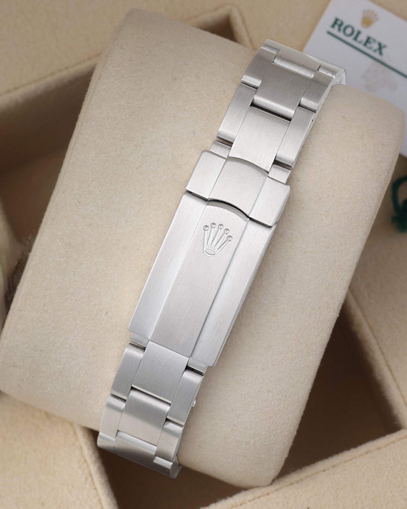 Rear view of the brushed stainless steel three-link Oyster bracelet highlighting the folding Oysterclasp with the embossed Rolex crown
