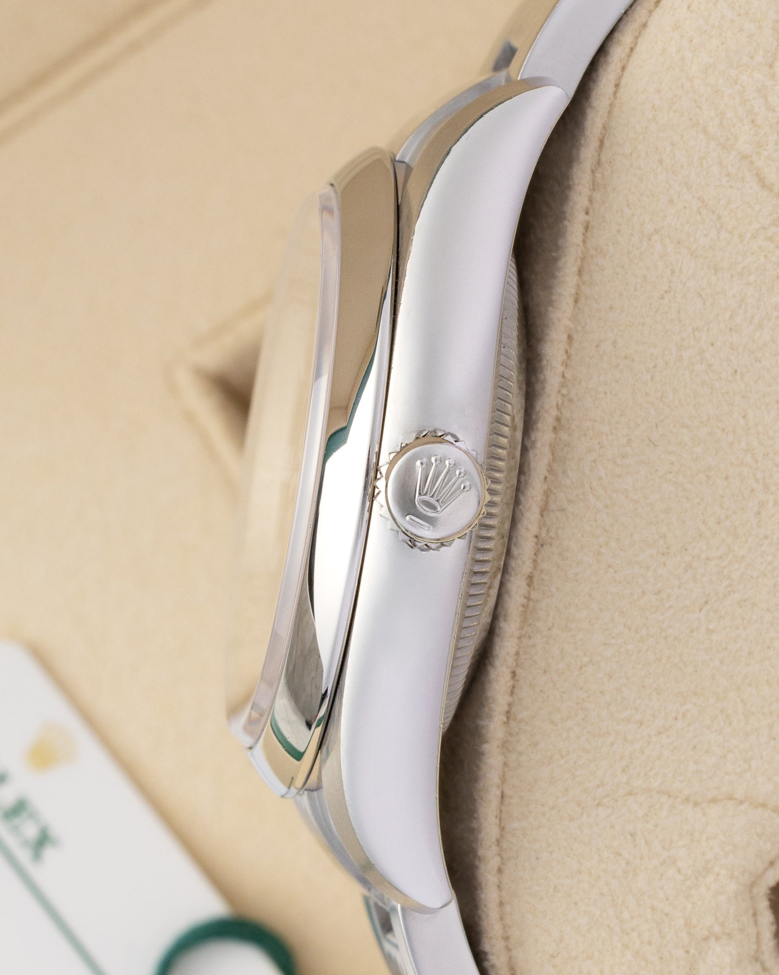Side profile view showing the Twinlock winding crown and stainless steel case of a 36mm Rolex Oyster Perpetual 116000