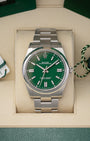 Pre-owned 2022 Rolex Oyster Perpetual 41 ref 124300 with bright green dial, box, and papers at Noah's Fine Watches & Jewelry in Dallas, Texas