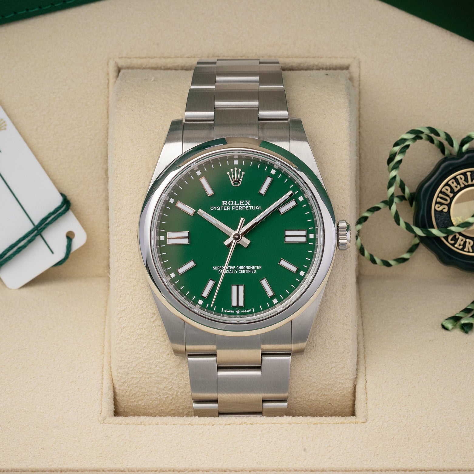 Pre-owned 2022 Rolex Oyster Perpetual 41 ref 124300 with bright green dial, box, and papers at Noah's Fine Watches & Jewelry in Dallas, Texas