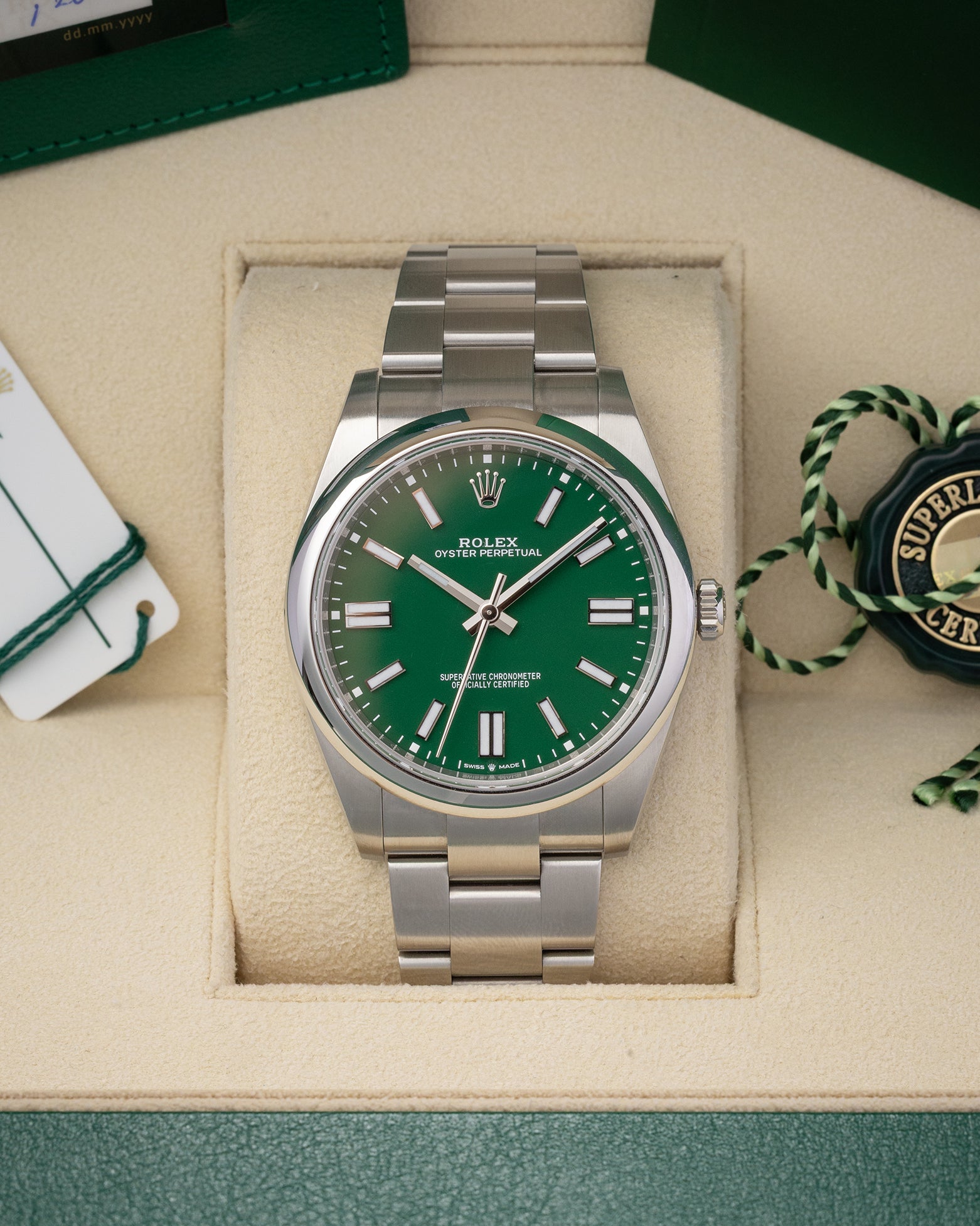 Pre-owned 2022 Rolex Oyster Perpetual 41 ref 124300 with bright green dial, box, and papers at Noah's Fine Watches & Jewelry in Dallas, Texas