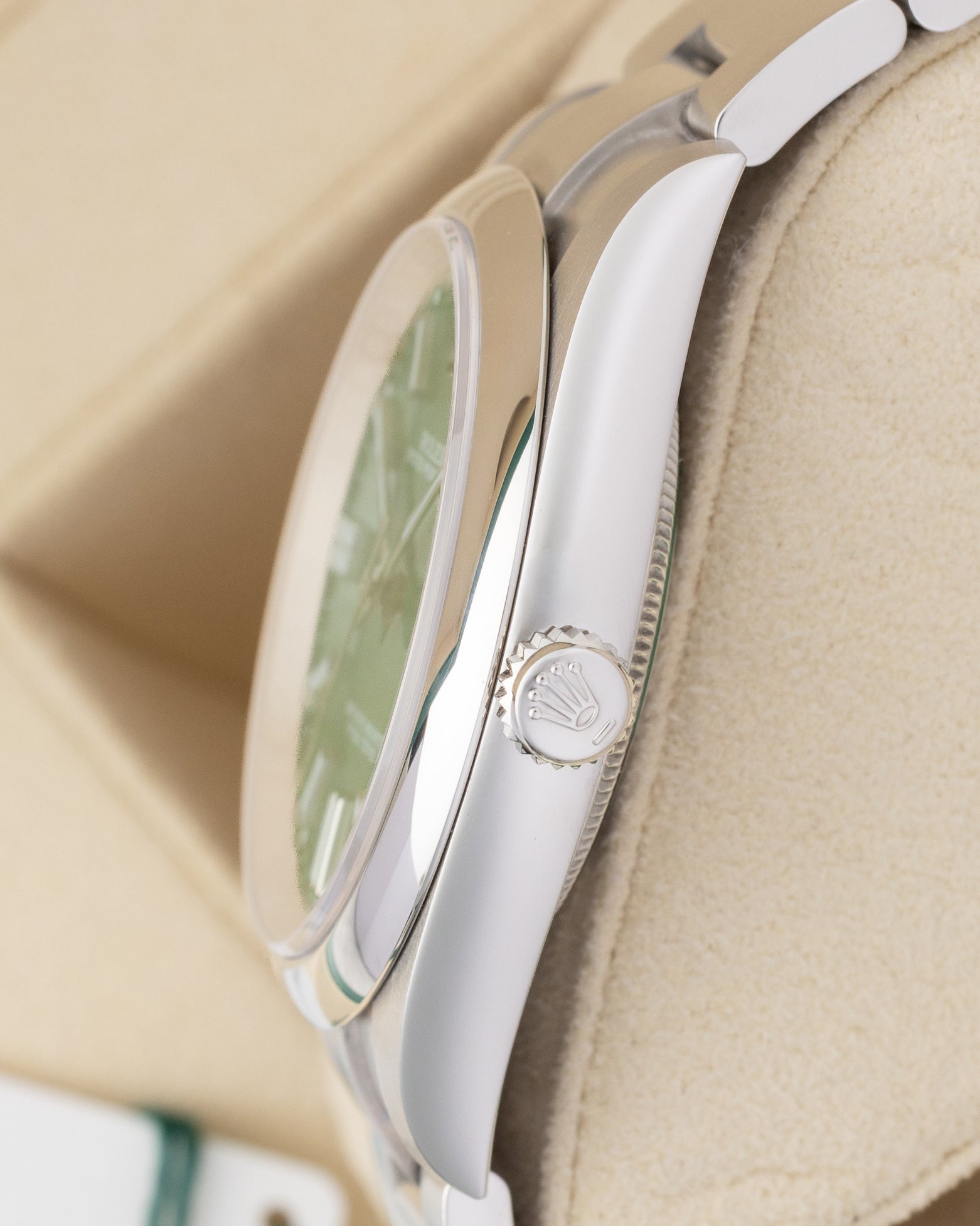 Side profile view showing the Twinlock winding crown and stainless steel case of a 41mm Rolex Oyster Perpetual 124300