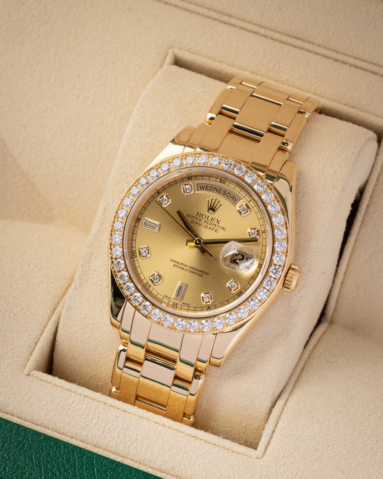 portrait of the 39mm yellow gold masterwork case showcasing the texturing of the round brilliant cut bezel diamonds and the arc-shaped day window