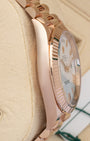Left-side macro profile view showcasing the heavy, mirror-polished 18k Everose gold case wall flank and the seamless, solid integration of the semi-circular endlinks