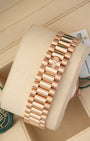 A rear view of the three-piece semi-circular solid gold link band focusing on the completely flush closure of the concealed folding Crownclasp with a raised Rolex crest lever
